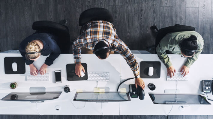 over head view of people working in an office