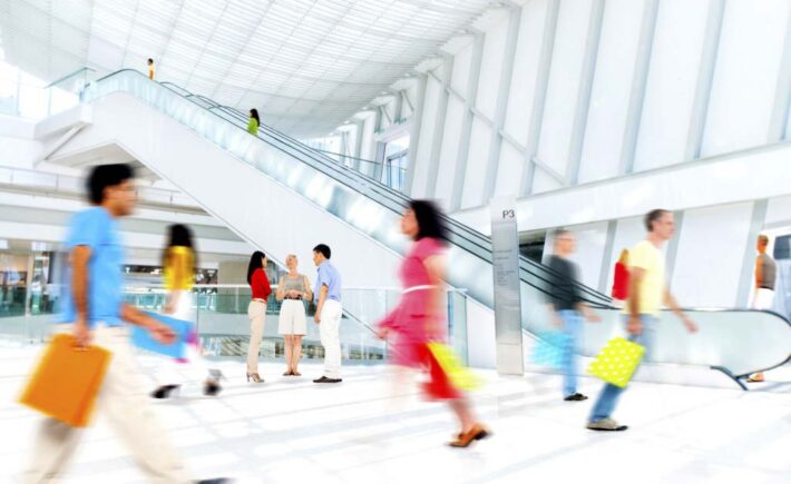 women dancing in a mall