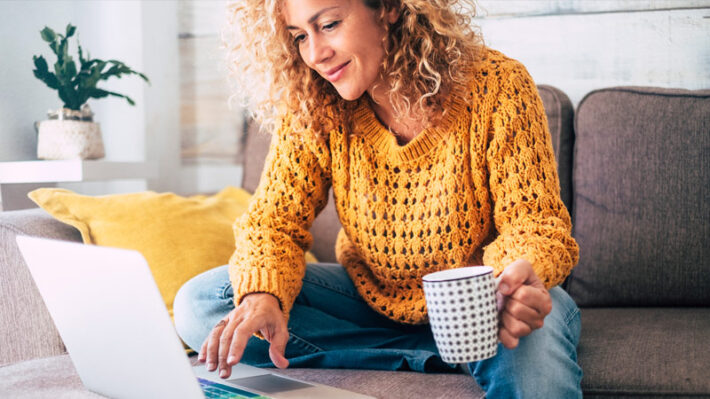 a consumer browsing a website on their laptop