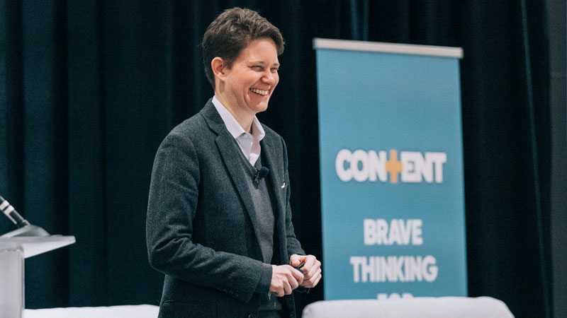 a man speaking at a conference