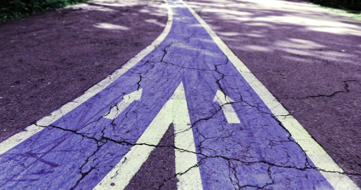 ext: a road of two merging lanes—both are purple. 