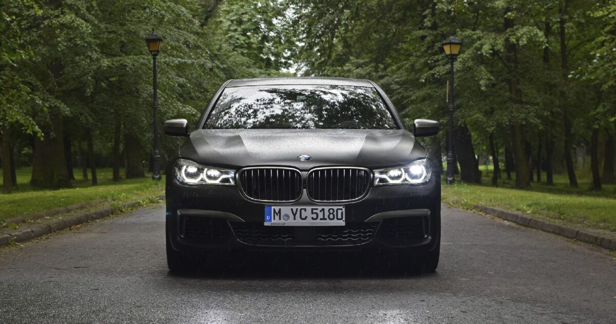 a black BMW sedan facing us 