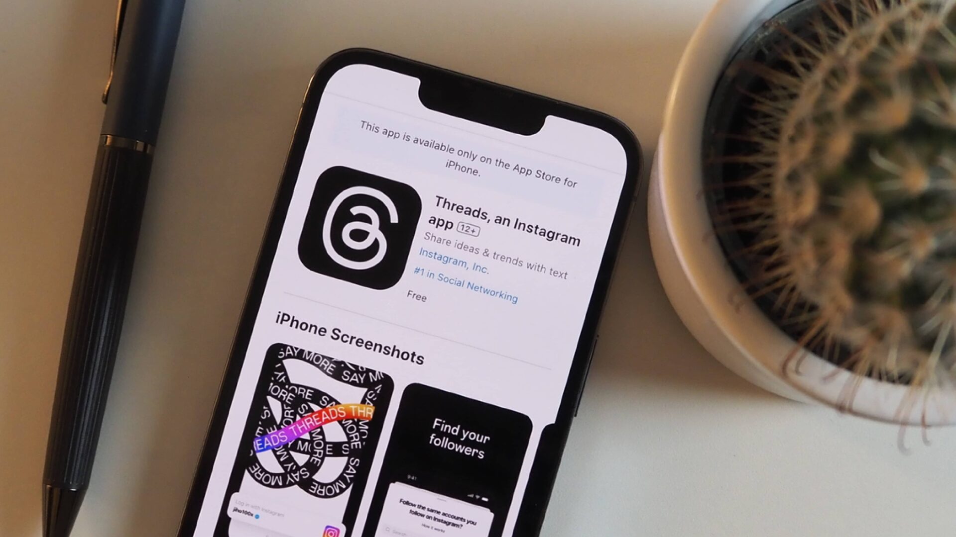 a phone in the App Store viewing the new Threads app