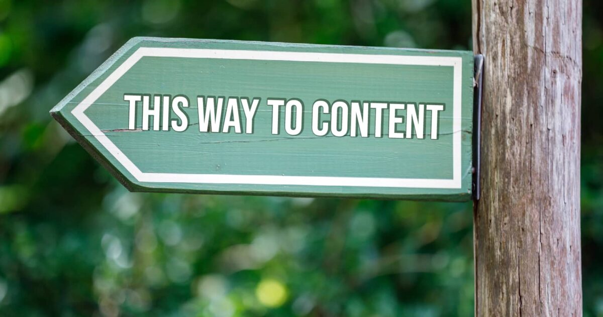 A sign saying "this way to content"