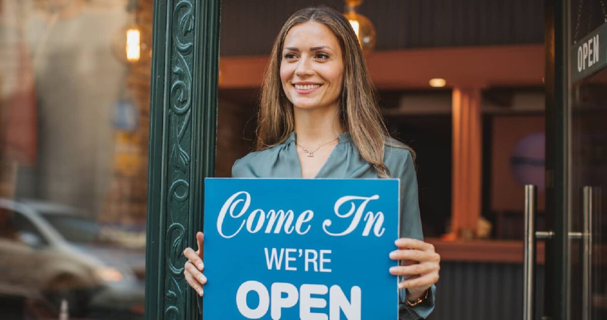 A store sign that says "come in, we're open."