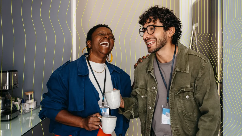 Two company employees smiling