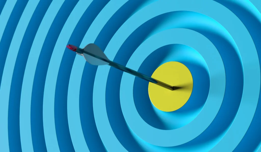 An arrow hitting a bullseye
