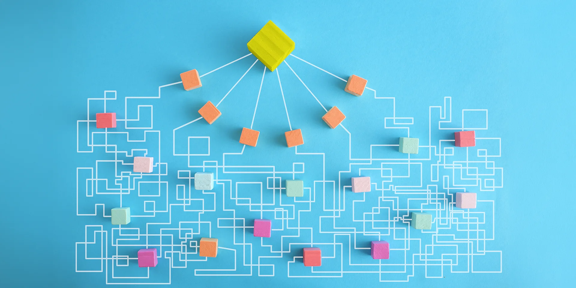 Colorful blocks connected by branching white lines on a blue background, representing the complex paths customers take when discovering and interacting with brands in the age of AI.